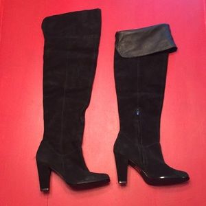 Thigh high black leather boots